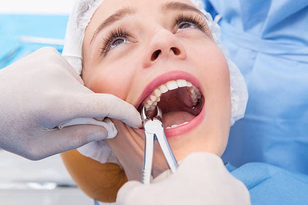 When is tooth extraction recommended?