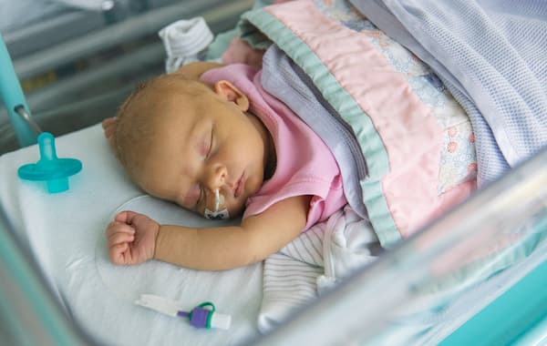 What causes biliary atresia?