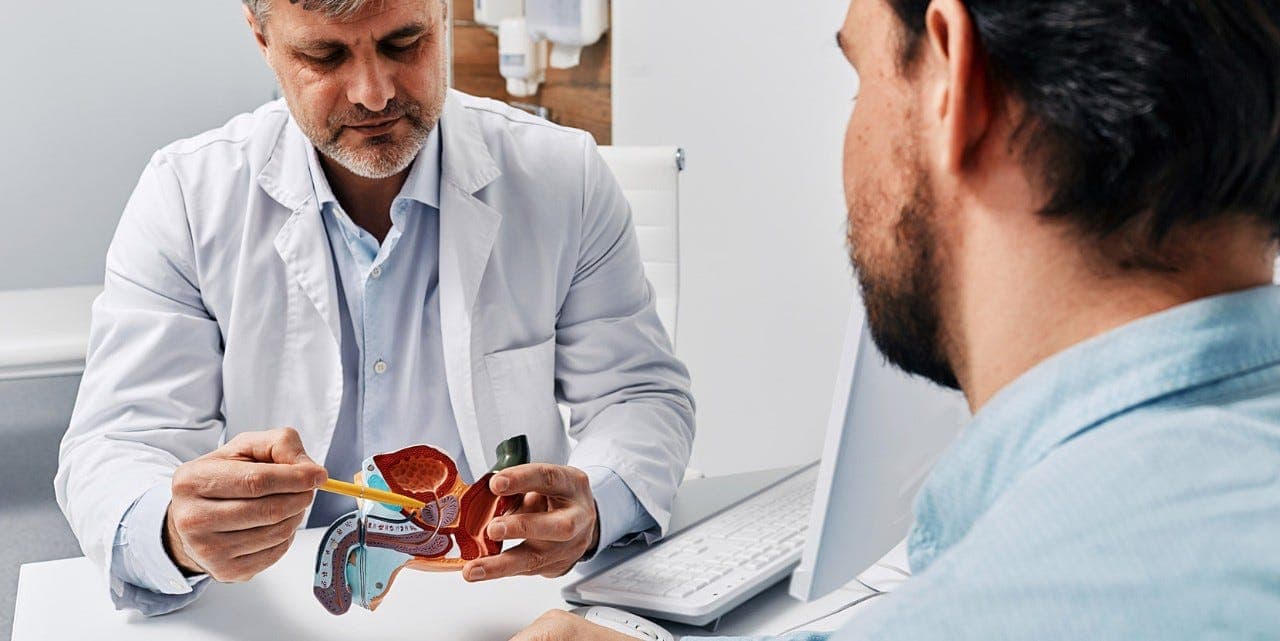 What are the complications of an enlarged prostate?